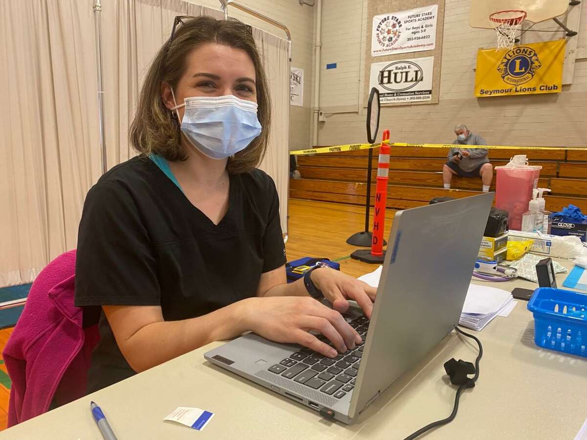 Kristie D'Averso, public health nurse with the Naugatuck Valley Health District, was among a group of nurses and EMTs that visited homebound Shelton residents on April 7 to administer COVID-19 vaccines.
