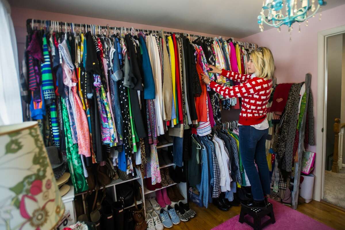 Jodi Bromley displays her vintage clothing collection Tuesday, Feb. 16, 2021 at her home in Midland. (Katy Kildee/kkildee@mdn.net)