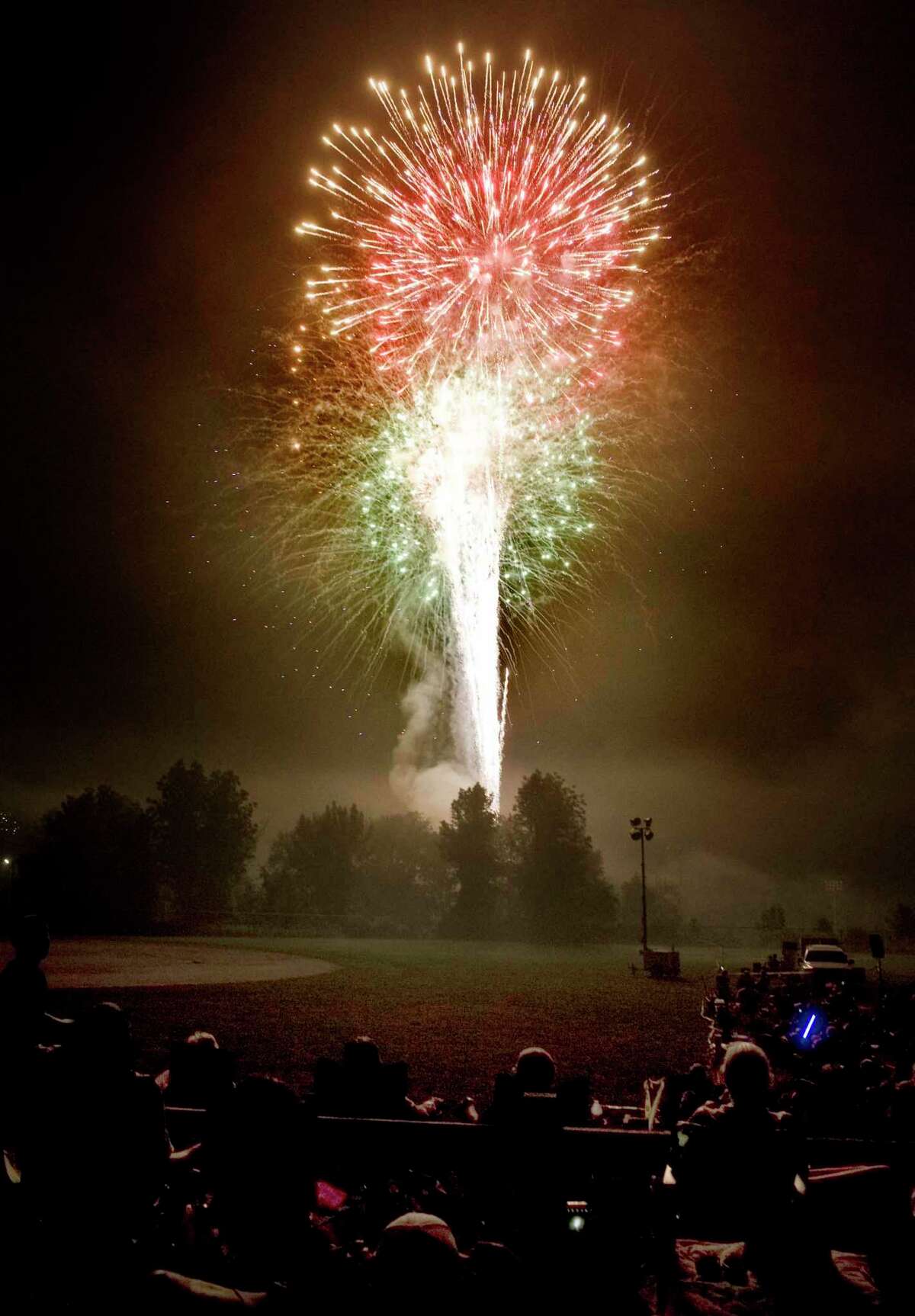 Spectators enjoying the Fourth of July fireworks at Ridgefield High School. Wednesday, July 4, 2018