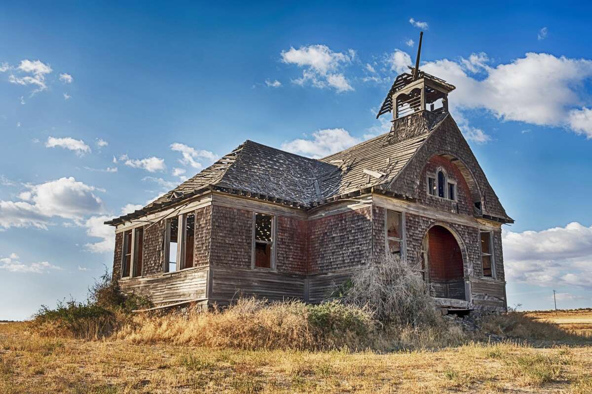 The old schoolhouse in the ghost town of Govan, Washington is rumored to be haunted by past murders.