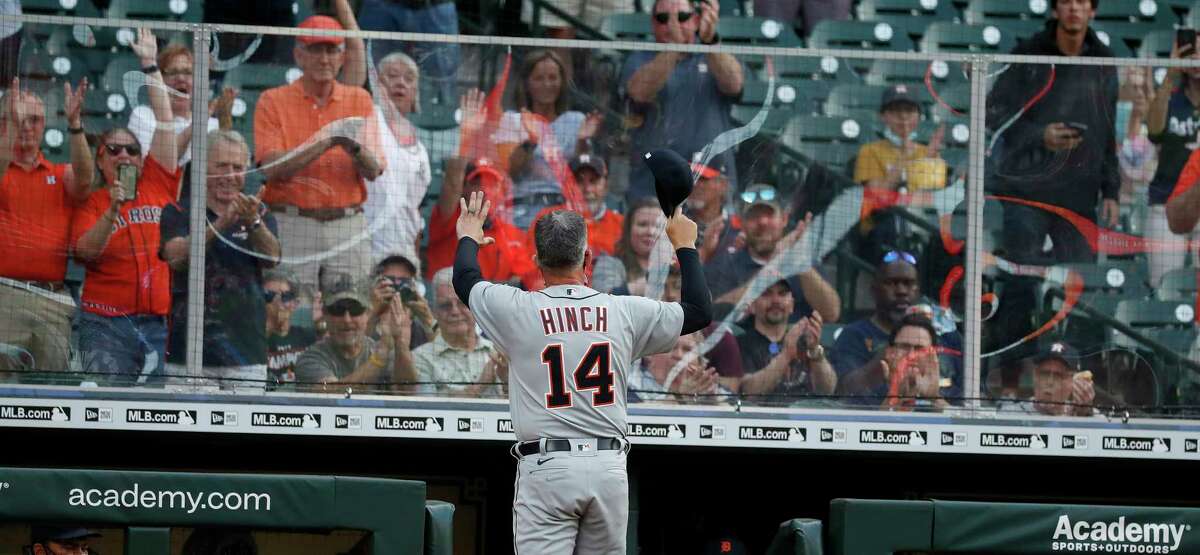 Detroit Tigers manager A.J. Hinch (14) tips his cap to the cheering Houston Astros fans before the start of the first inning of an MLB baseball game at Minute Maid Park, in Houston, Monday, April 12, 2021.