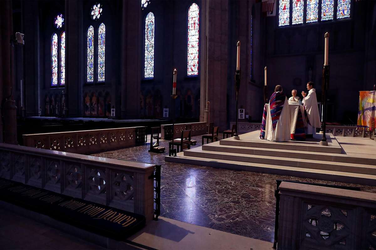 (right to left) Dean Malcolm Young, Bishop Marc Andrus and Vice Dean Ellen Clark-King during virtual Easter Sunday service at Grace Cathedral in San Francisco, Calif., on Sunday, April 12, 2020.