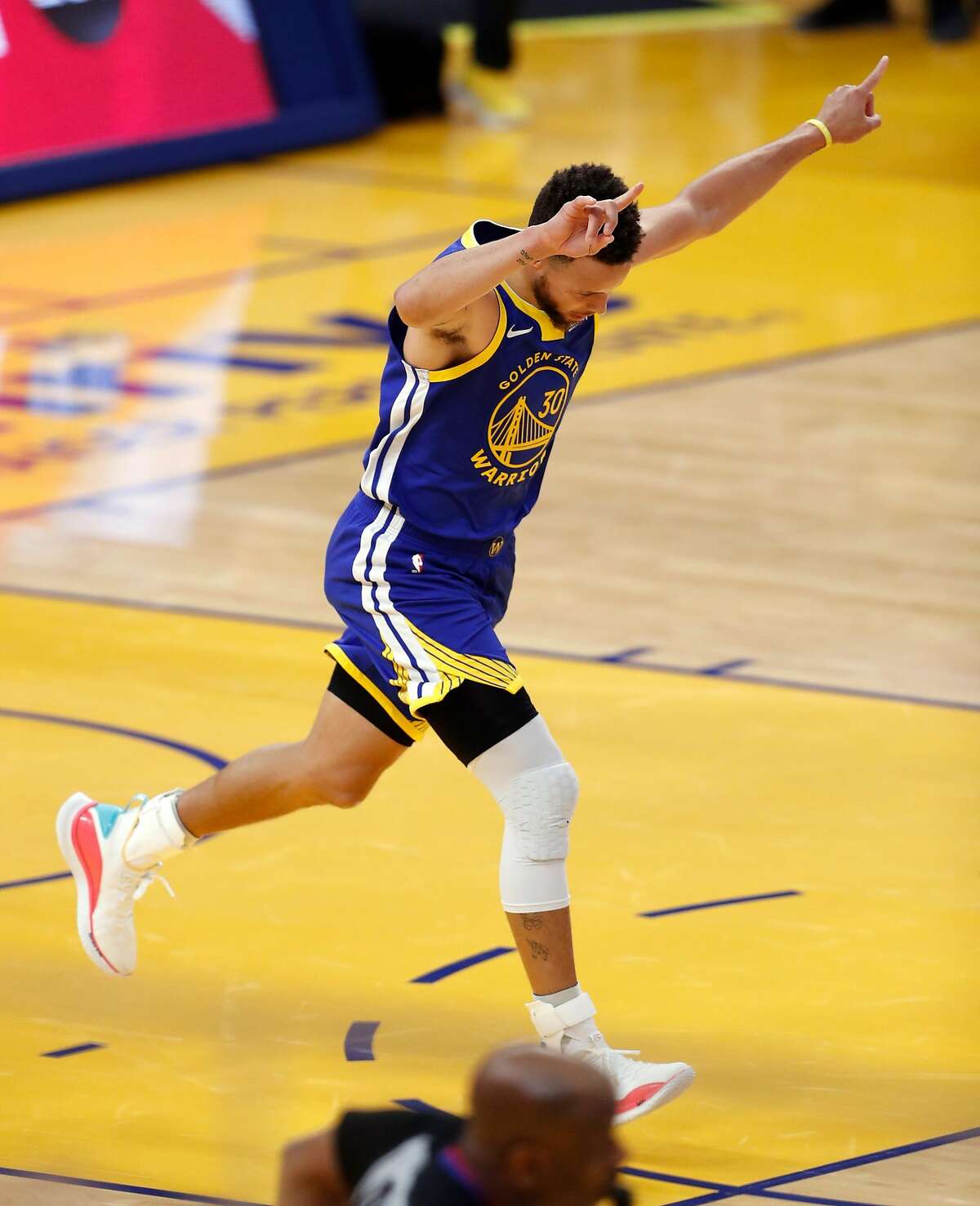 Golden State Warriors' Stephen Curry reacts to passing Wilt Chamberlain as franchise's leading career score after scoring a 1st quarter basket against Denver Nuggets during 1st quarter of NBA game at Chase Center in San Francisco, Calif., on Monday, April 12, 2021.