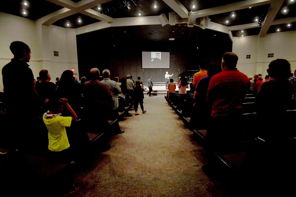 Jim Pickering leads attendees as they join in a prayer vigil for Orange County Sheriff's officer Dru Crochet at Eastgate United Pentecostal Church in Vidor Monday. The three officers are battling serious illesses, prompting the community to rally together in prayers and support. The event included altar calls for any in need of healing at its finale. Photo made Monday, April 12, 2021 Kim Brent/The Enterprise