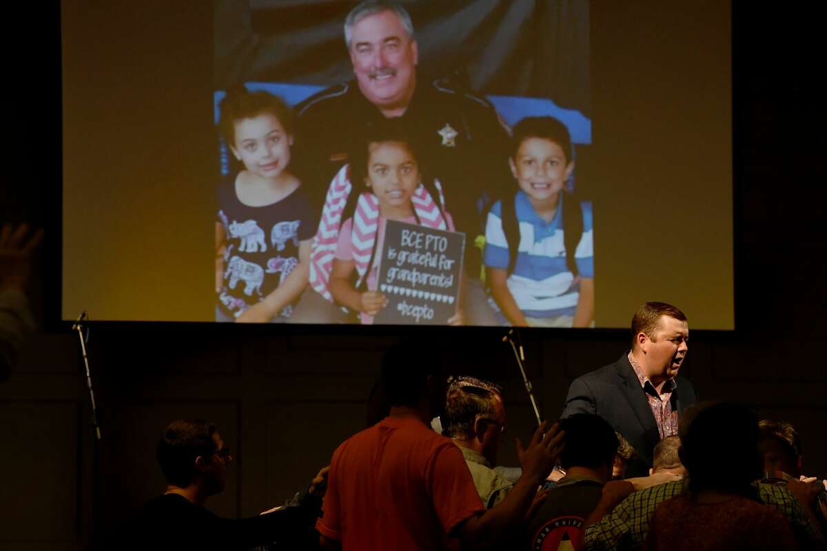 Worship leader Jeremy Fletcher leads attendees as they join in a prayer vigil for Orange County Sheriff's officers Dru Crochet and Scott Barnes and Orange City Policeman Howard DeVault at Eastgate United Pentecostal Church in Vidor Monday. The three officers are battling serious illesses, prompting the community to rally together in prayers and support. The event included altar calls for any in need of healing at its finale. Photo made Monday, April 12, 2021 Kim Brent/The Enterprise