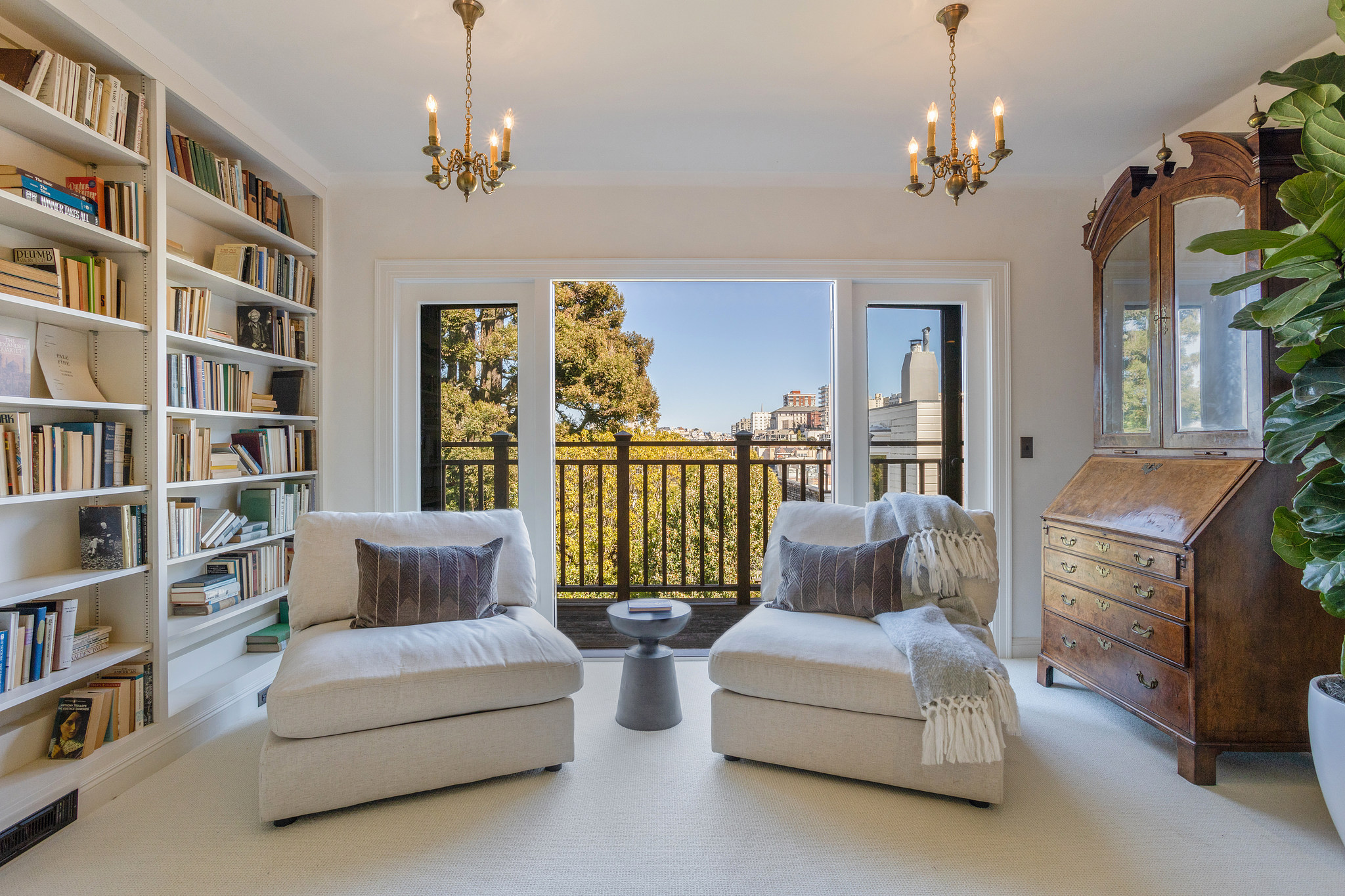 The primary bedroom features a step-out balcony with Pac Heights views.