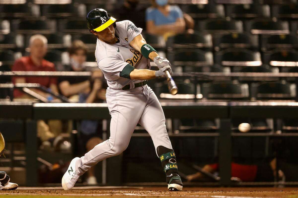 PHOENIX, ARIZONA - APRIL 12: Ramon Laureano #22 of the Oakland Athletics hits a single against the Arizona Diamondbacks during the third inning of the MLB game at Chase Field on April 12, 2021 in Phoenix, Arizona. (Photo by Christian Petersen/Getty Images)
