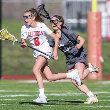 Greenwich's Grace Collier (6) is pressured by Longmeadow's Jenna Joseph in a 2019 game.