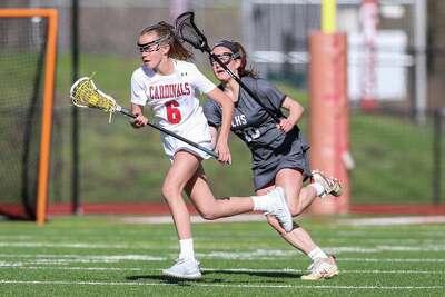Greenwich's Grace Collier (6) is pressured by Longmeadow's Jenna Joseph in a 2019 game.