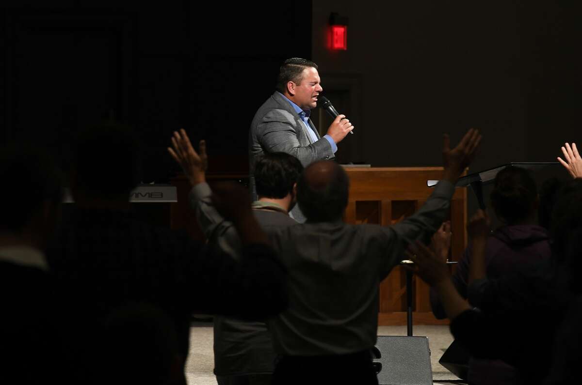 Worship leader Jeremy Fletcher leads attendees as they join in a prayer vigil for Orange County Sheriff's officers Dru Crochet and Scott Barnes and Orange City Policeman Howard DeVault at Eastgate United Pentecostal Church in Vidor Monday. The three officers are battling serious illesses, prompting the community to rally together in prayers and support. The event included altar calls for any in need of healing at its finale. Photo made Monday, April 12, 2021 Kim Brent/The Enterprise