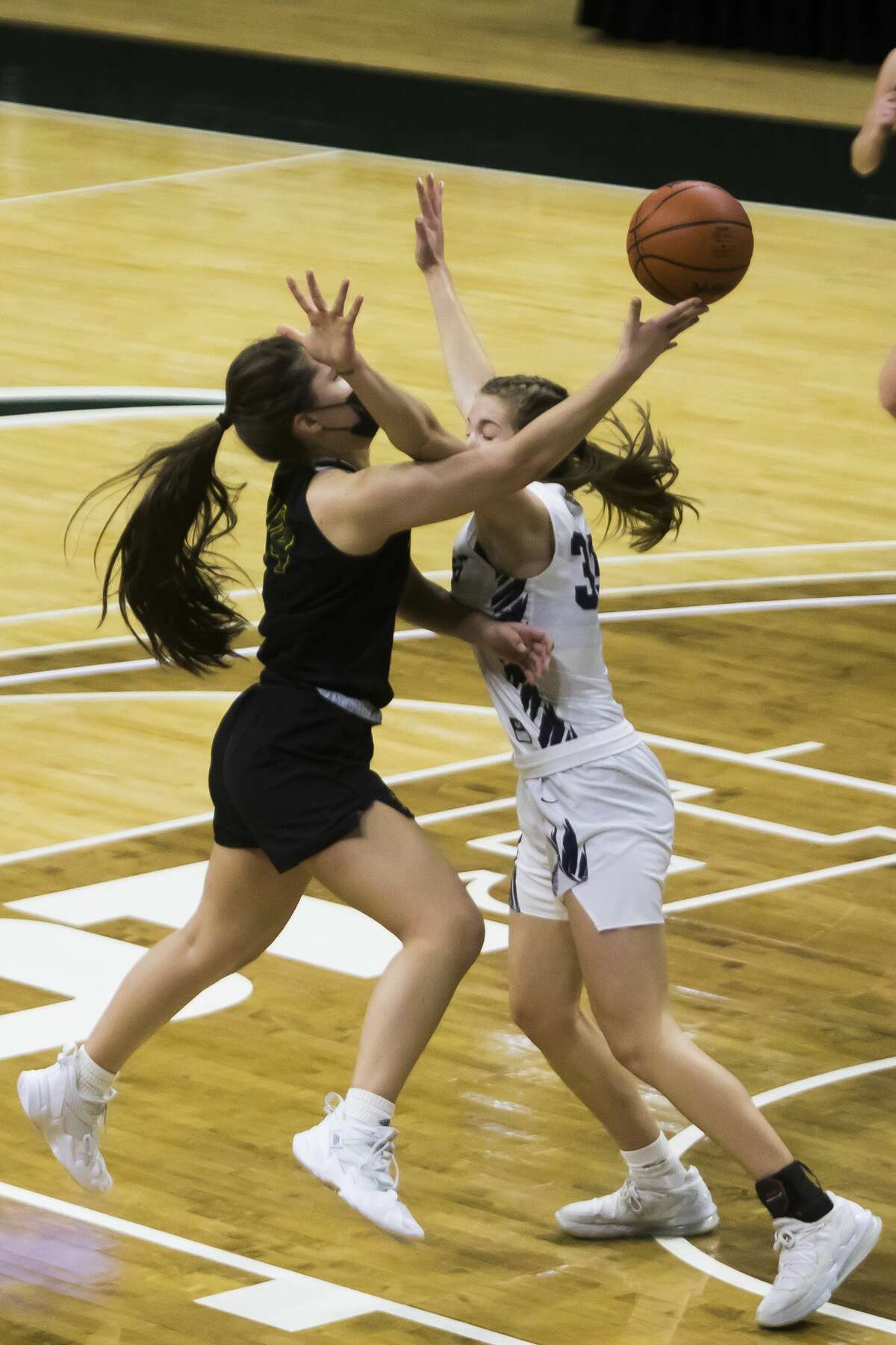 Dow High's Abby Rey goes hard to the rim during an April 7, 2021 state semifinal against Hudsonville.
