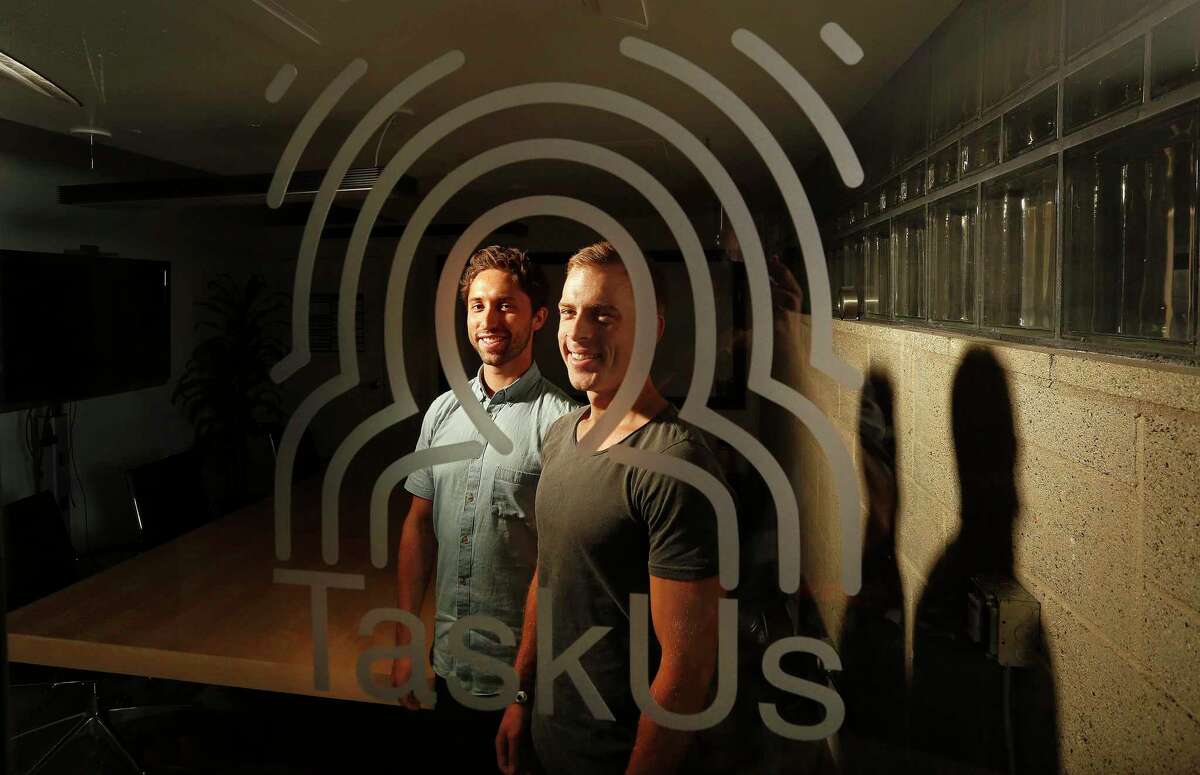 TaskUs co-founders Jaspar Weir, left, and Bryce Maddock in 2015, when the tech services company was based in Santa Monica, Calif. The firm moved to Texas in 2018, and currently is headquartered in New Braunfels. TaskUs’ customers include Facebook, Netflix, Uber and Zoom. (Mel Melcon/Los Angeles Times/TNS)