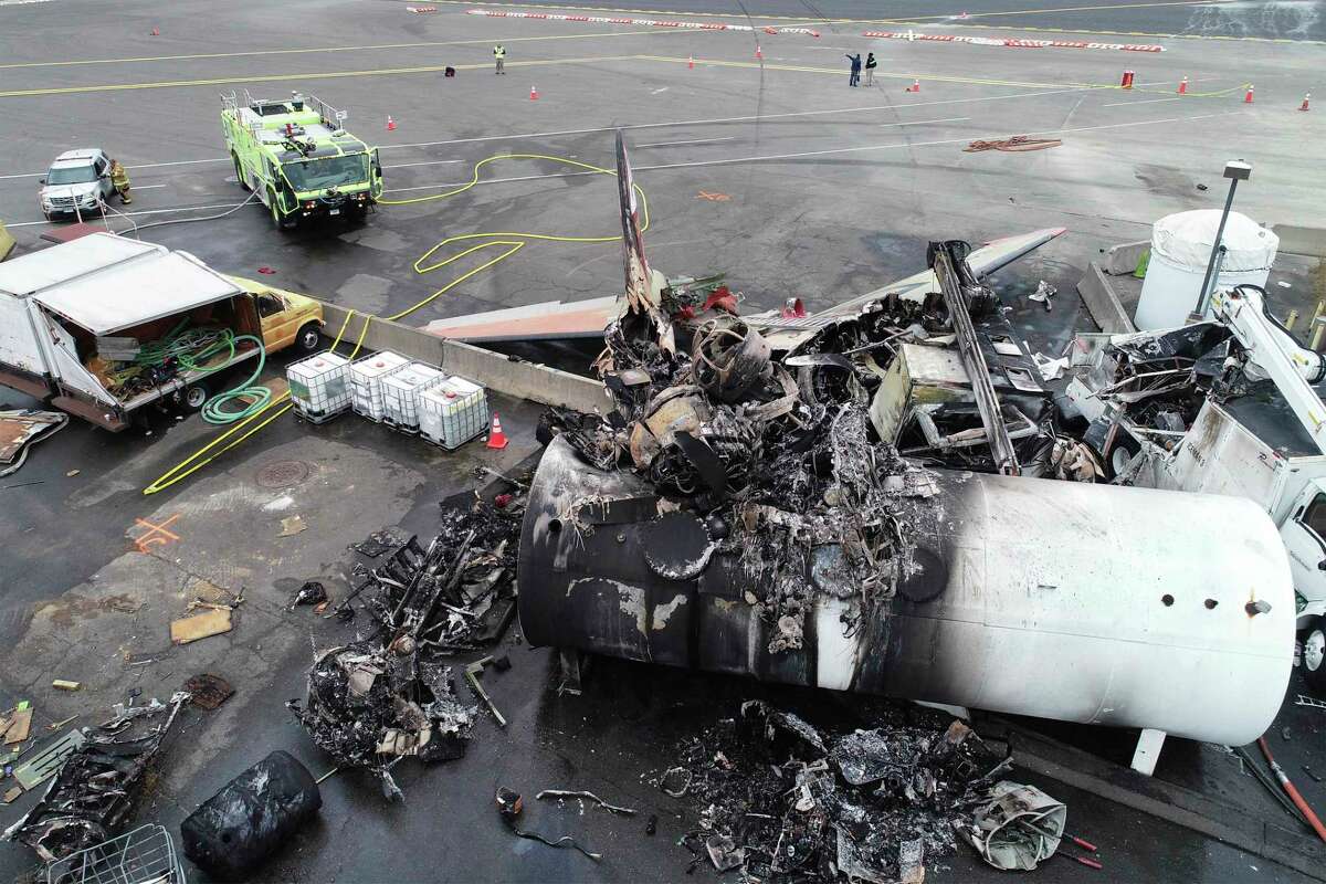 This photo, provided by the National Transportation Safety Board, shows damage from a World War II-era B-17 bomber plane that crashed on Oct. 2, 2019, at Bradley International Airport in Windsor Locks. Pilot error was the probable cause of the 2019 crash that killed seven people and wounded six others, the NTSB said in a report released Tuesday that also cited inadequate maintenance as a contributing factor.