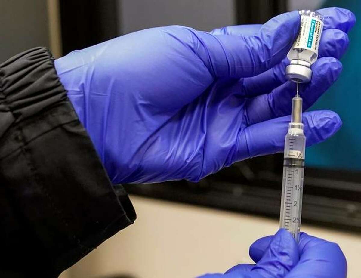 In this March 31 file photo, a nurse fills a syringe with a dose of the Johnson & Johnson’s one-dose COVID-19 vaccine in Uniondale, N.Y. The U.S. is recommending a “pause” in administration of the single-dose Johnson & Johnson COVID-19 vaccine to investigate reports of potentially dangerous blood clots.