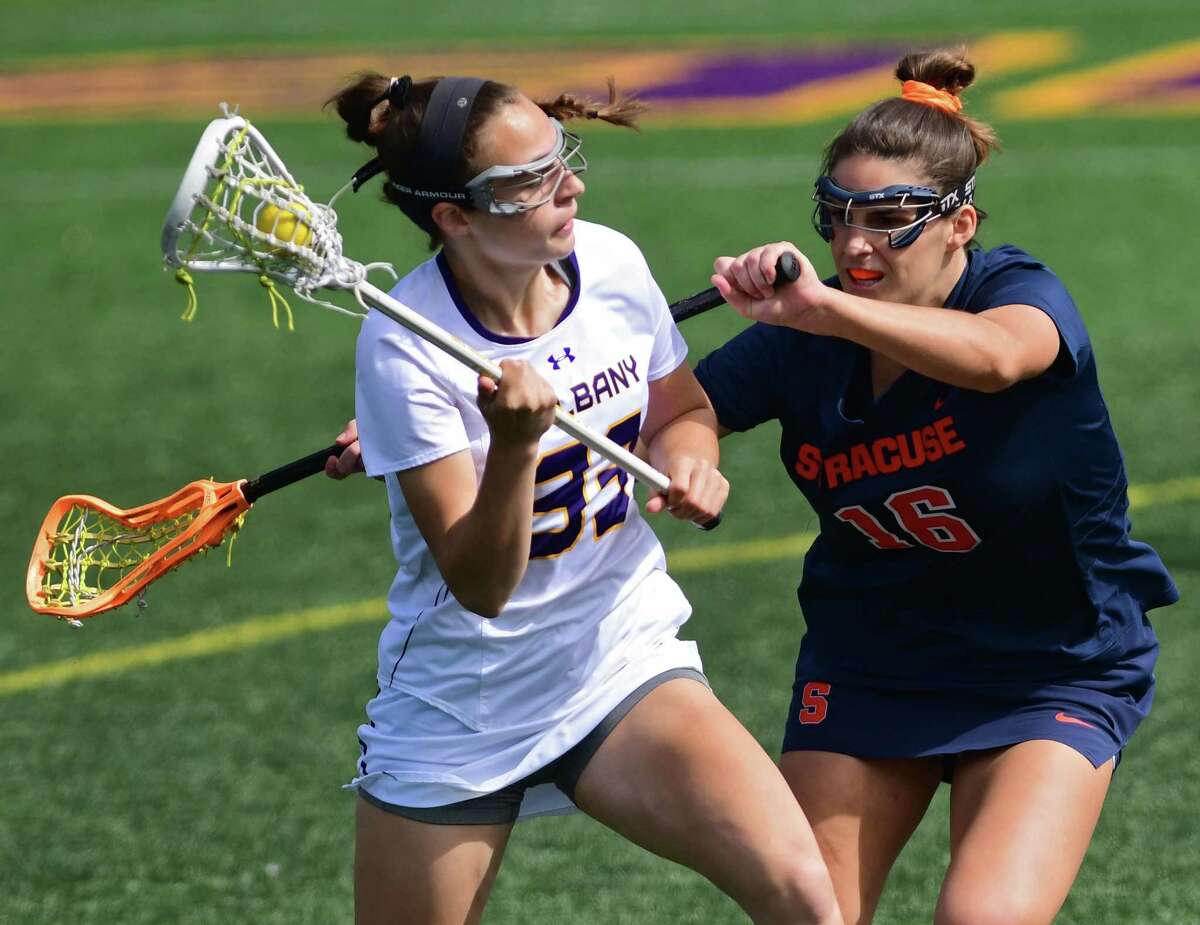 UAlbany’s Sarah Falk, left, shown last season, had six goals and an assist in a win over UMass Lowell on Saturday, April 23, 2022.