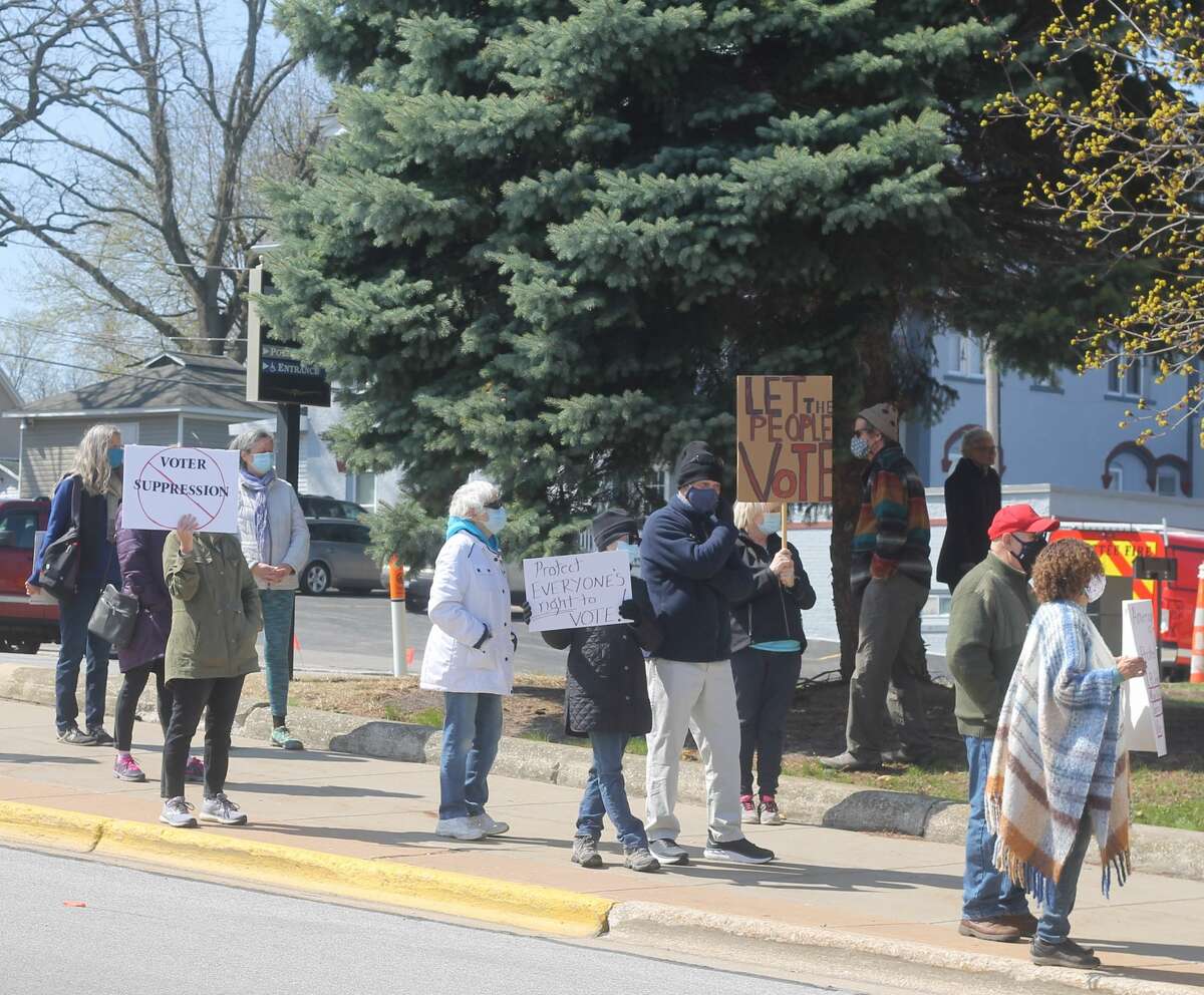 Over two dozen people attended a rally at Manistee City Hall on Tuesday in support of voting rights.