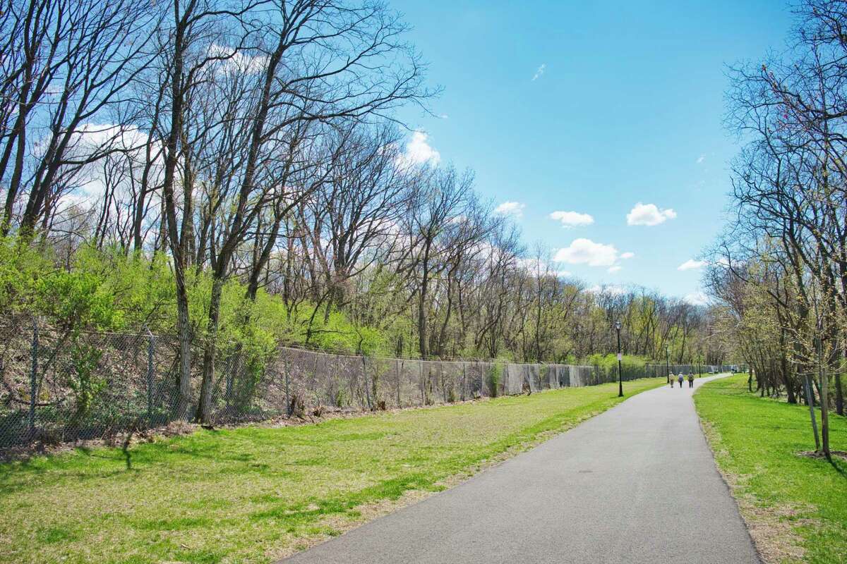 A view of the fenced in area, on left, that is the former Ford Motor Company property, seen here next to the bike path at the end of Cannon St. in Green Island, N.Y. Photo taken on Tuesday, April 13, 2021. The Green Island Industrial Development Agency wants to develop 30 acres of this land. (Paul Buckowski/Times Union)