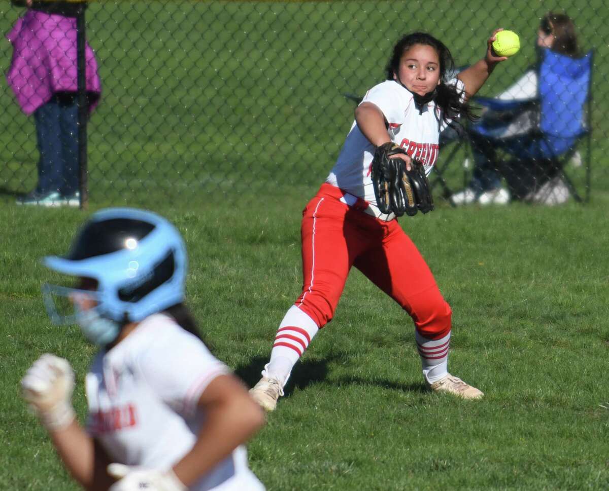 Greenwich left fielder Ciarra Castro makes a throw against Stamford on Tuesday.