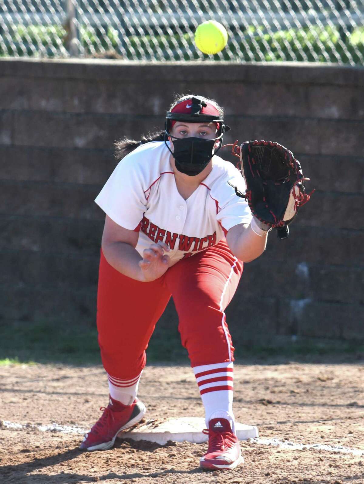 Greenwich’s Chloe Smith catches a throw at first base against Stamford on Tuesday.
