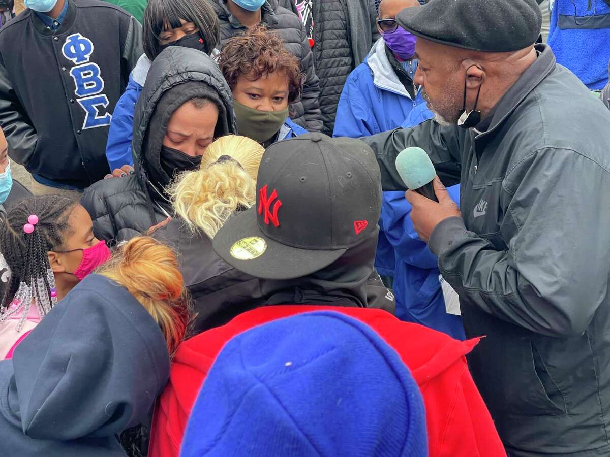 The Rev. Henry Brown of Mothers United Against Violence consoles Solmary Cruz, the mother of 3-year-old Randell Jones, who was killed Saturday in a drive-by shooting in Hartford.