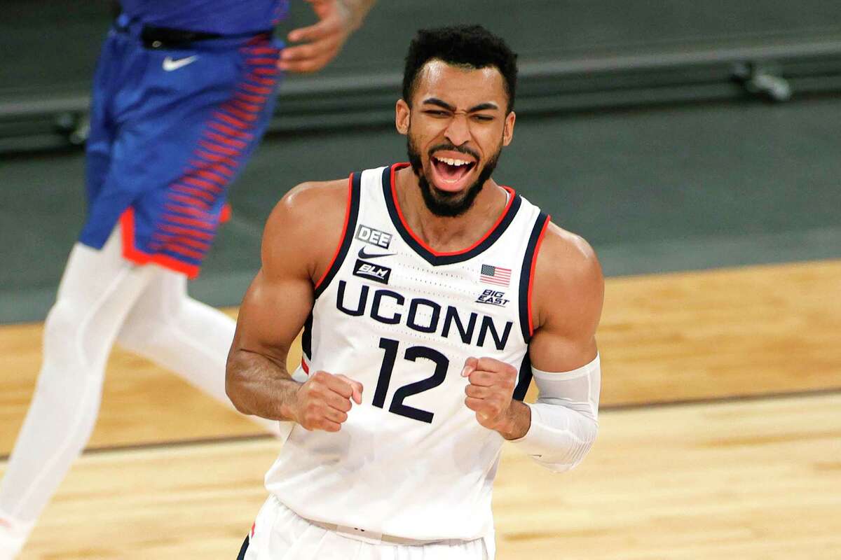 NEW YORK, NEW YORK - MARCH 11: Tyler Polley #12 of the Connecticut Huskies reacts in the first half against the DePaul Blue Demons during the Quarterfinals of the Big East Tournament at Madison Square Garden on March 11, 2021 in New York City. (Photo by Sarah Stier/Getty Images)
