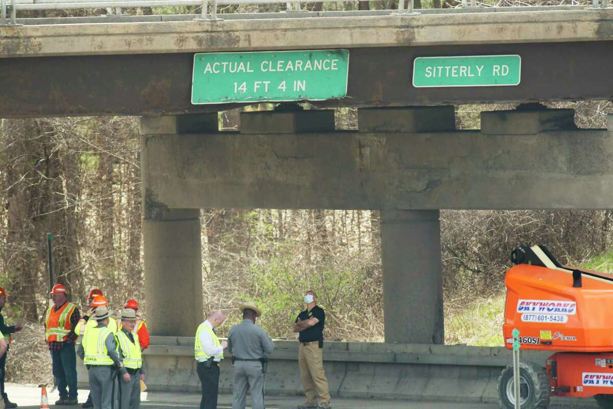A view of the Sitterly Road overpass above Interstate 87 on Wednesday, April 14, 2021, in Clifton Park, N.Y. A truck towing a trailer with a boom lift and traveling south on I-87, struck the bridge, resulting in all lanes of I-87 southbound to be shut down to traffic. The permanent replacement will begin to be build in spring 2022. (Paul Buckowski/Times Union)
