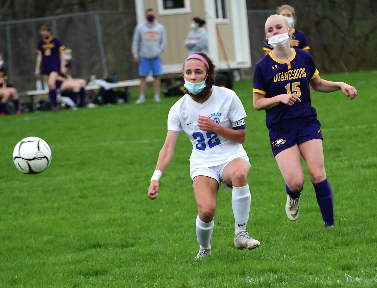 Schoharie’s Katie Krohn kicks the ball while defended by Duanesburg’s Julianna Perillo during a soccer game on Wednesday, April 14, 2021 in Delanson, N.Y. (Lori Van Buren/Times Union)
