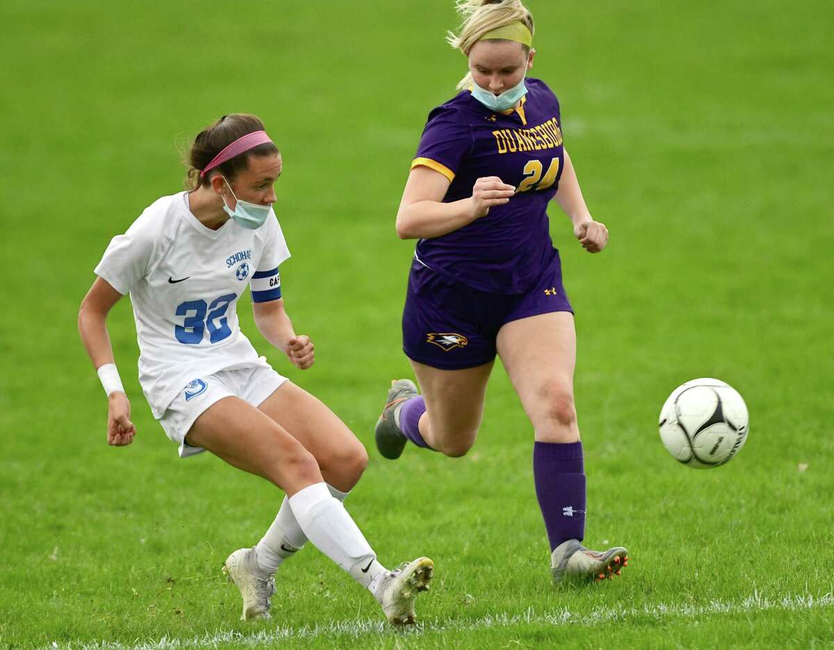 Schoharie’s Katie Krohn, left, scores while defended by Duanesburg’s Taylor Meyer during a soccer game on Wednesday, April 14, 2021. She now has 232 career goals.