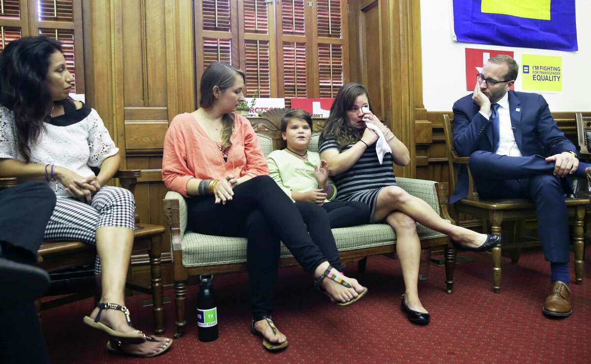 Human Rights Campaign President Chad Griffin listens as Marilyn Morrison, a child struggling with transgender issues, describes life at school during a round table discussion in the offices of State Representative Jessica Ferrar's office at the State Capitol on August 3, 2017. Chelsa Morrison, Marilyn's mother, fights back tears during the account. Next to Marilyn, Rachel Gonzales listens with Angie Castro (far left).