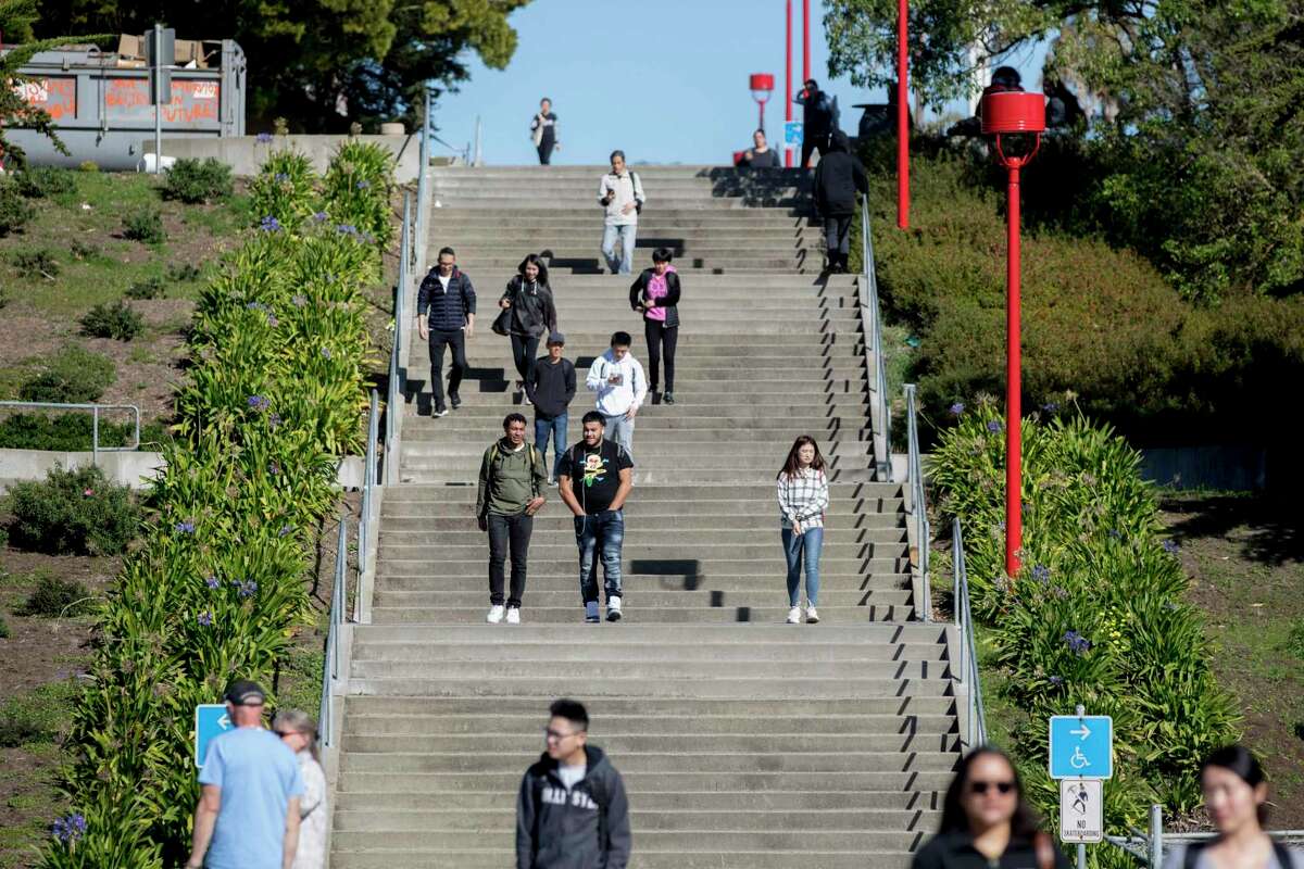 Students descend the staircase leading from Science Hall at City College of San Francisco.