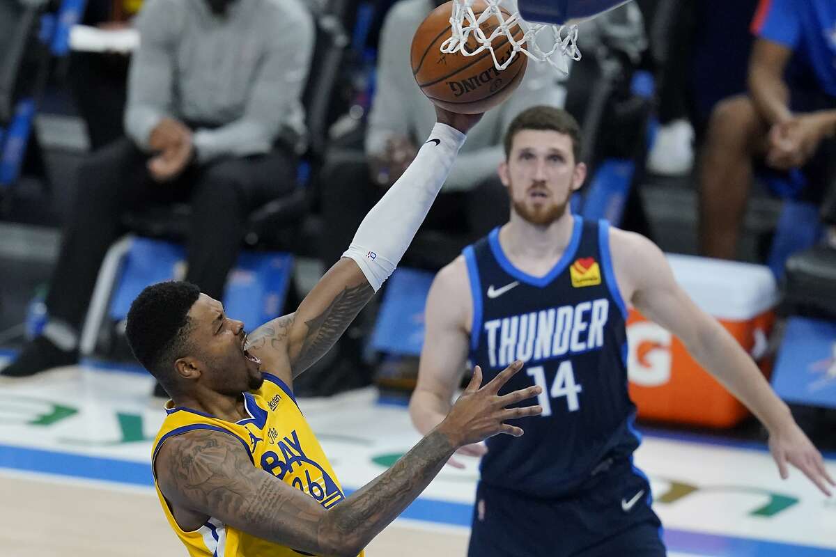 The Warriors’ Kent Bazemore shoots in front of the Thunder’s Svi Mykhailiuk in the second half of Golden State’s 147-109 rout in Oklahoma City. Bazemore scored 15 points in 21 minutes.