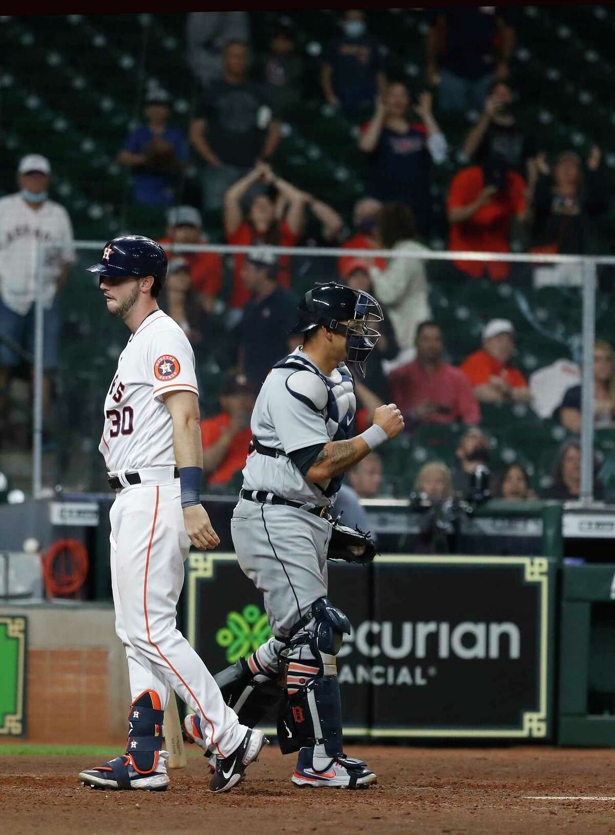 Houston Astros right fielder Kyle Tucker (30) reacts after striking out with the bases loaded to end the ninth inning of an MLB baseball game at Minute Maid Park, in Houston, Wednesday, April 14, 2021.