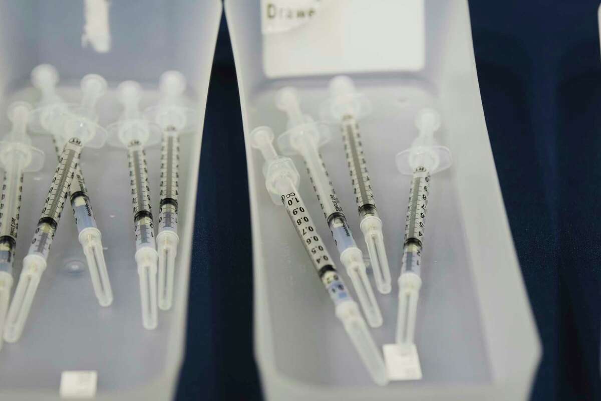 Syringes containing the Pfizer vaccine are seen in trays before the start of a vaccination clinic at The College of Saint Rose on Thursday, April 15, 2021, in Albany, N.Y. The college had 500 appointments available and was offering them to current students, faculty and staff, along with also allowing family members of the Saint Rose community, and new students who will be joining the college in the fall. (Paul Buckowski/Times Union)