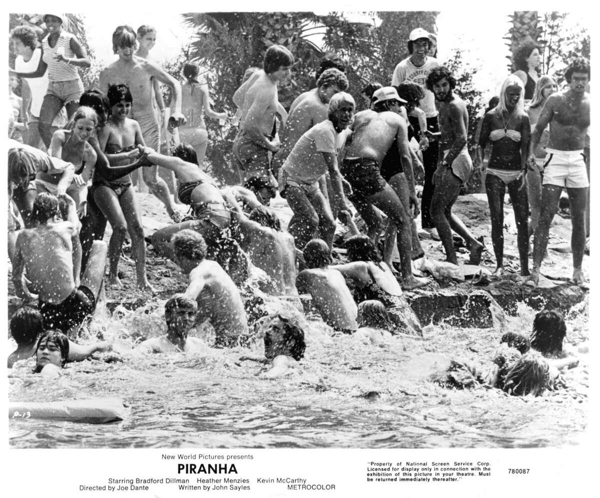 Swimmers rush from the lake in a scene from the film “Piranha” that was shot at Aquarena Springs. No swimming pigs or mermaids were harmed in the making of the film.