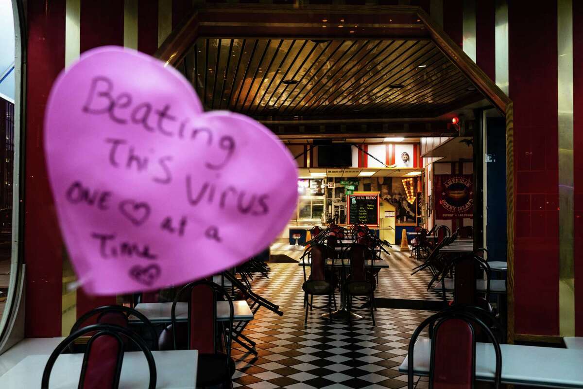 A heart emblazoned with a hopeful message appears at American Coney Island in Detroit. The popular tourist site is closed during Michigan's stay-at-home order during a coronavirus surge.