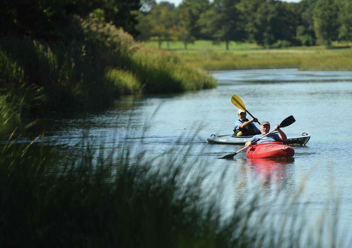 Friends Gary Nichols, left, and David Thornton, both of Fairfield, kayak on scenic Mill Creek in Westport, Conn. on Tuesday, September 17, 2019. Mill Creek forms the border of Sherwood Island State Park.