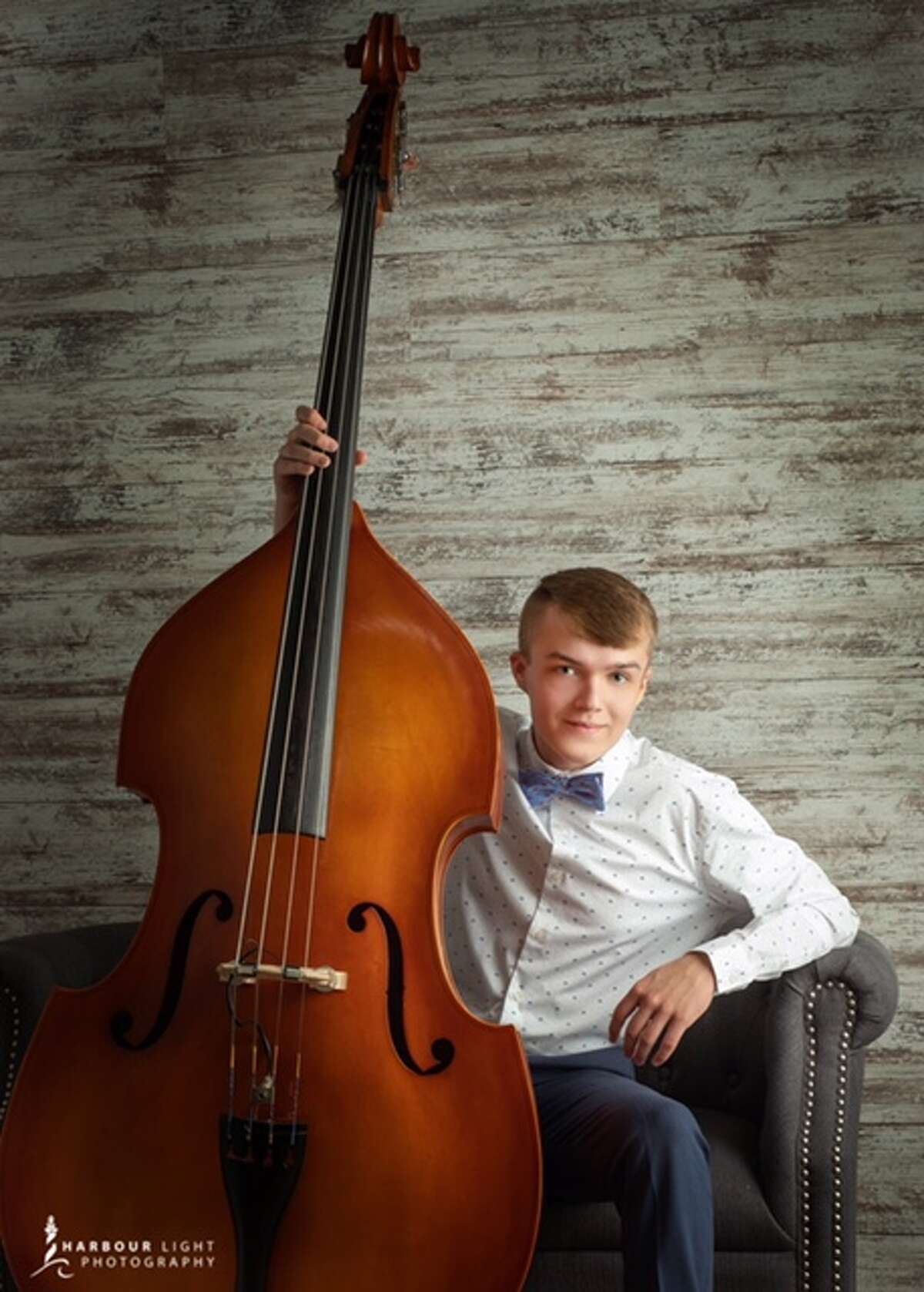 Aiden Shephard is pictured with his acoustic bass.