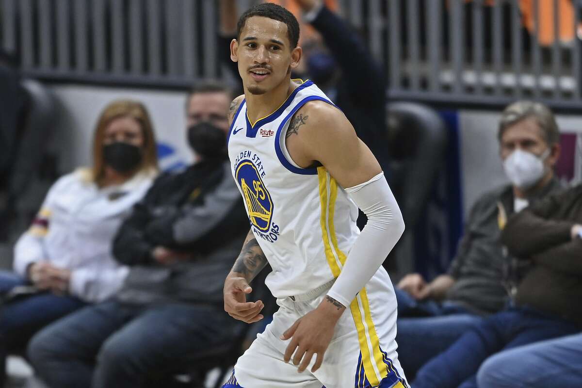 Golden State Warriors' Juan Toscano-Anderson (95) smiles after a three-point basket in the second half of an NBA basketball game against the Cleveland Cavaliers, Thursday, April 15, 2021, in Cleveland. (AP Photo/David Dermer)