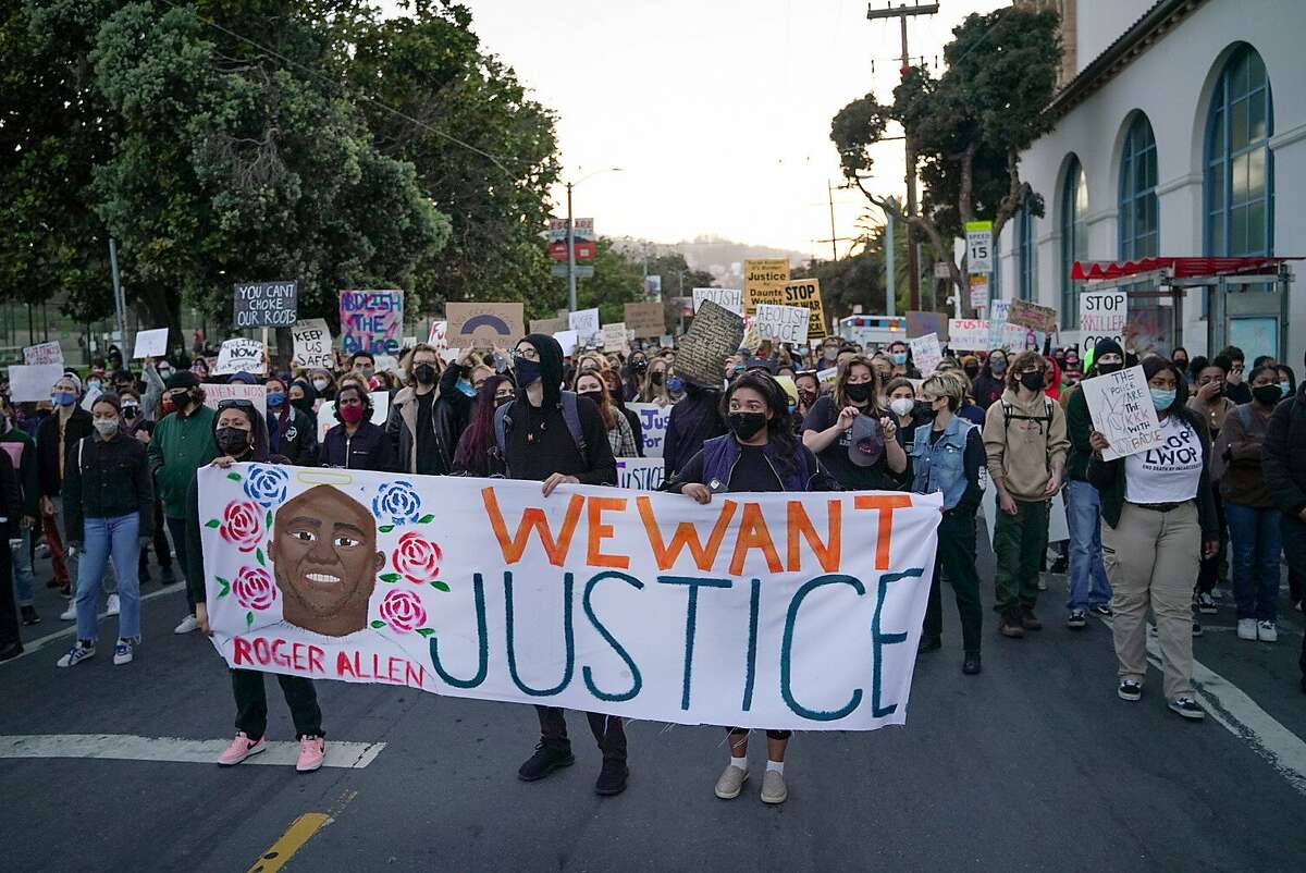 Demonstrators march outside San Francisco’s Mission High School to protest the killings of Roger Allen in S.F. by a Daly City officer and Daunte Wright by police in Minnesota.