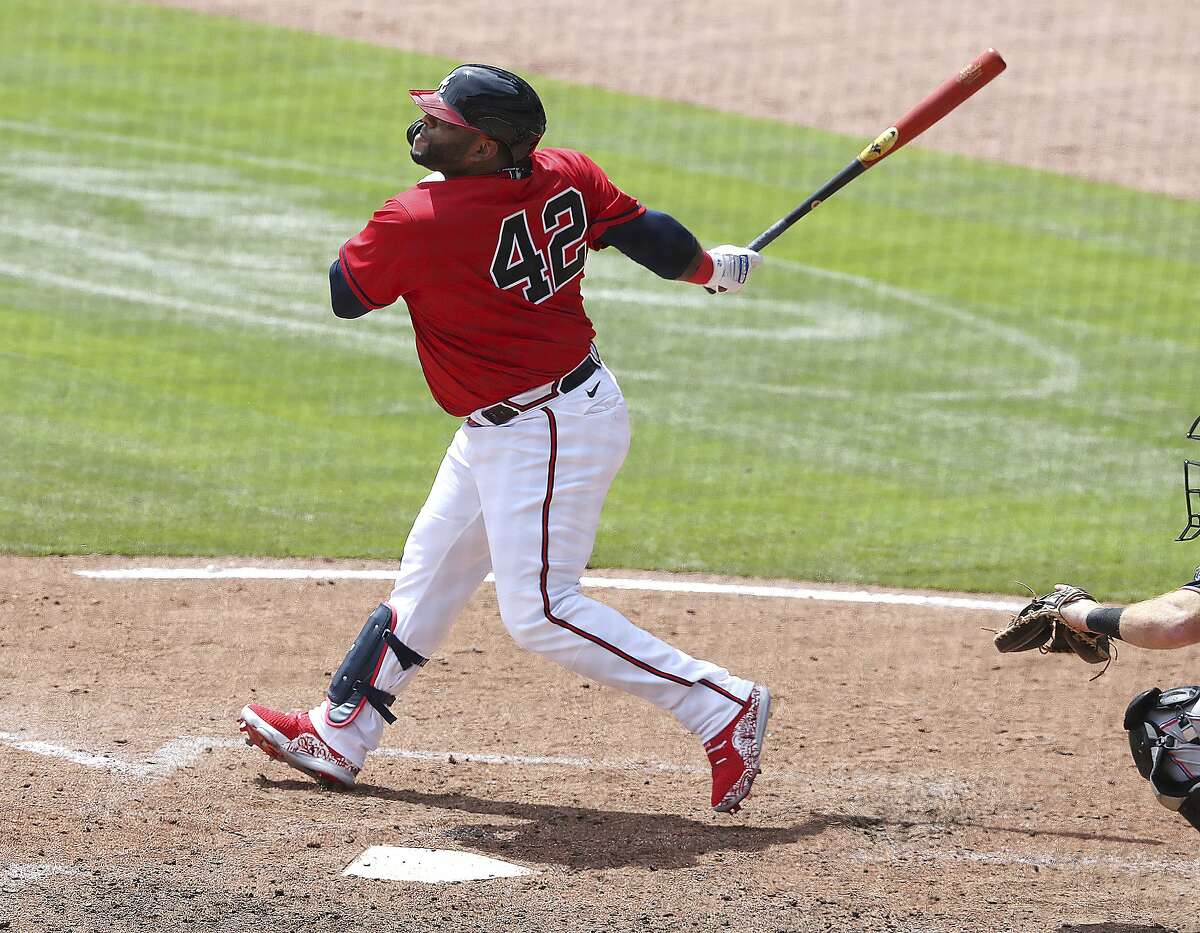 Atlanta Braves pinch hitter Pablo Sandoval hits a three-RBI home run against the Miami Marlins during the sixth inning of a baseball game Thursday, April 15, 2021, in Atlanta. (Curtis Compton/Atlanta Journal-Constitution via AP)