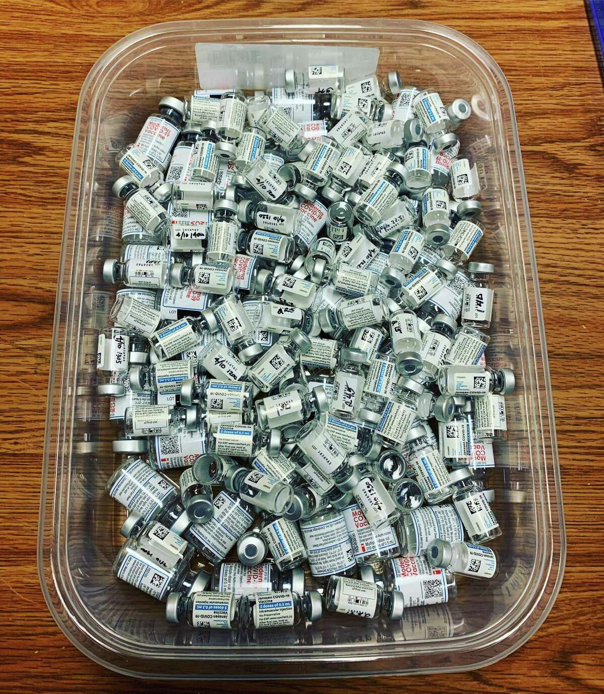 A tub that represents 1,112 vaccinations of Moderna and Johnson & Johnson vaccines, taken at the John Pettibone Community Center clinic in New Milford