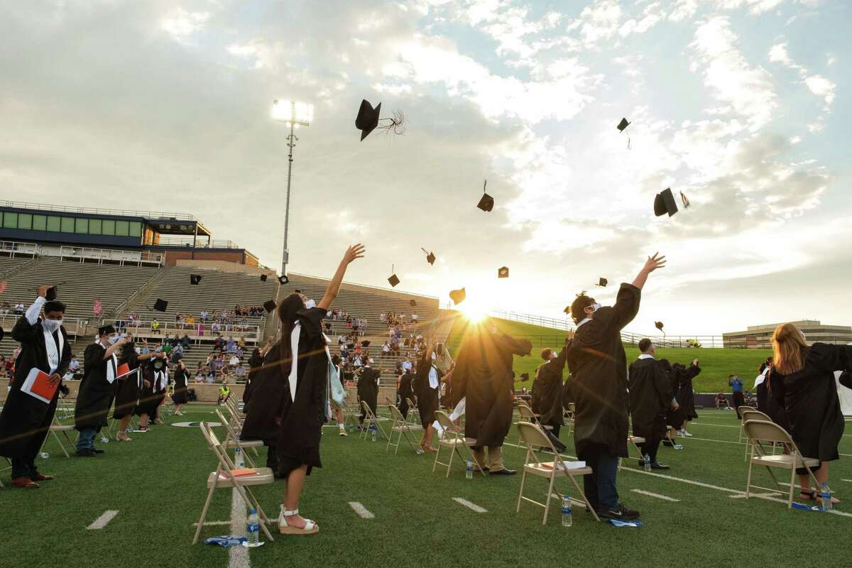 The new graduates from the Westchester Academy for International Studies class of 2020 throw their caps at the conclusion of the graduation ceremony on June 6 at Darrell Tully Stadium