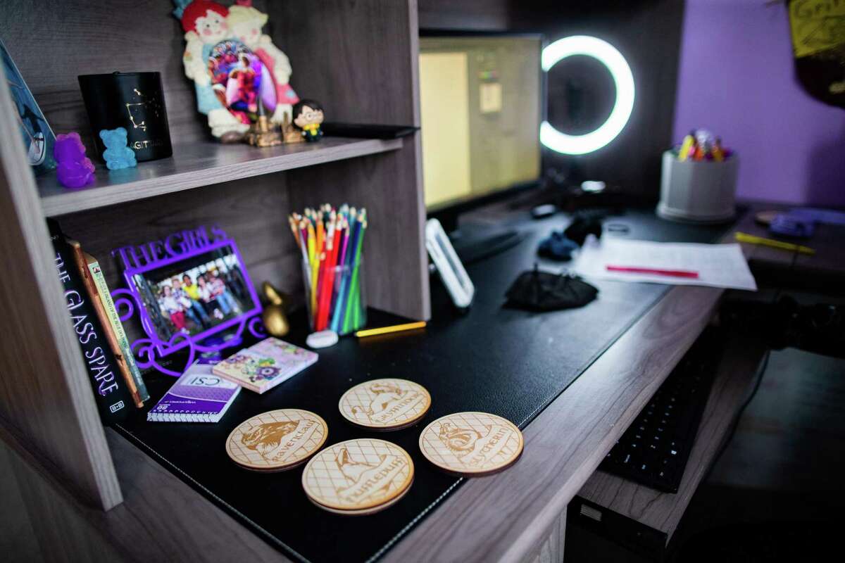Coasters designed by Beck Junior High School eighth-grader Ellen Holden, 14, that were 3-D printed for her engineering lab sit on a desk Thursday, April 15, 2021, at her home in Katy.