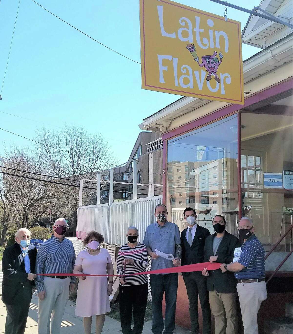 Latin Flavor in Middletown held a grand opening April 8. From left are Middlesex County Chamber of Commerce President Larry McHugh, Chairman Tom Byrne, Central Business Bureau Chairwoman Pamela Steele, chef Lydia Perez, owner Edwin Maldonado, Mayor Ben Florsheim, state Rep. Brandon Chafee and chamber ambassador and Common Council Minority Leader Phil Pessina.