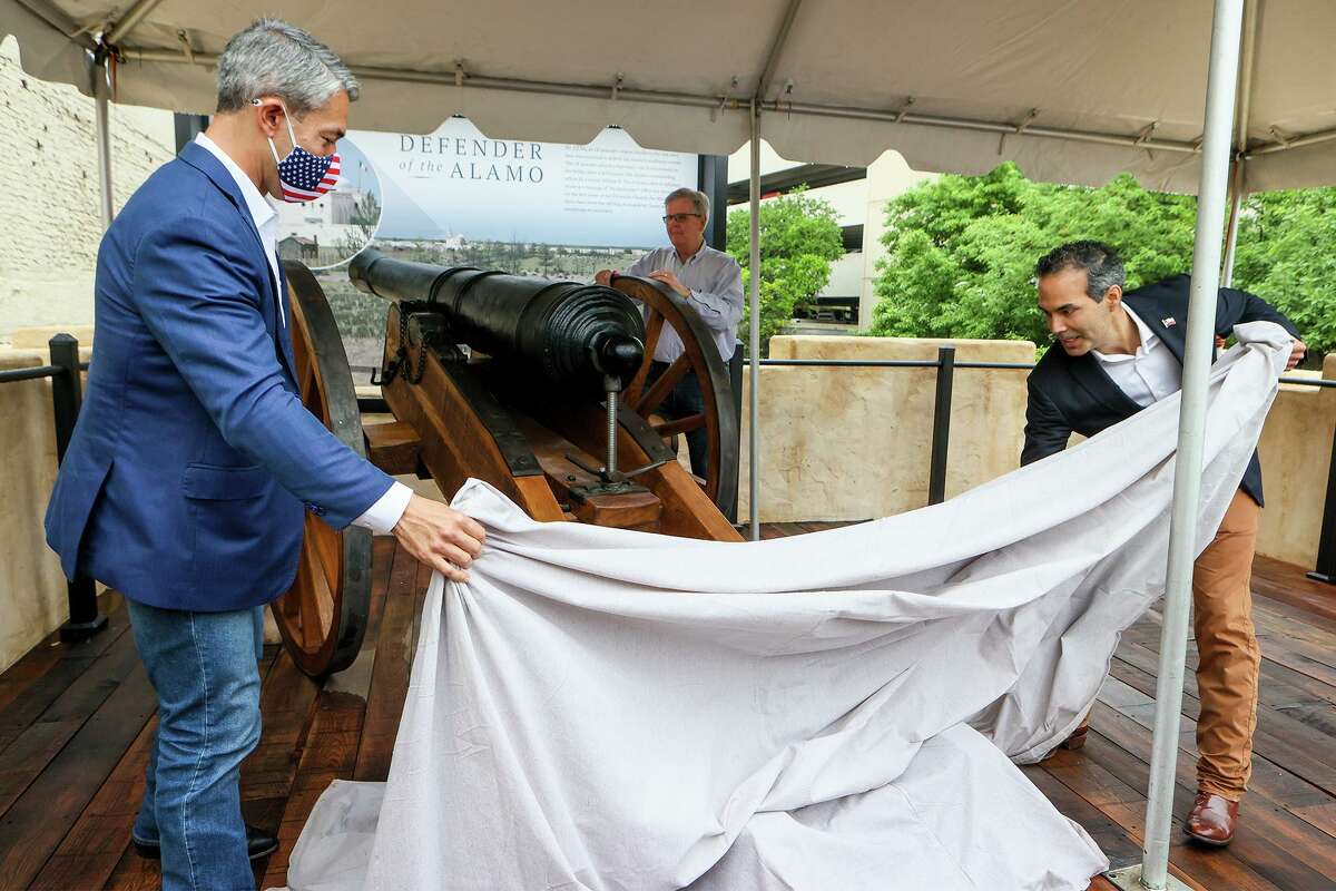 San Antonio Mayor Ron Nirenberg, from left, Texas Lt. Governor Dan Patrick and General Land Commissioner George P. Bush unveil the cannon in a new outdoor "18-Pounder/Losoya House Exhibit" in Alamo Plaza as state and local officials gathered for the unveiling on Friday, April 16, 2021. The new exhibit depicts the southwest corner cannon platform where the fort's "18-pounder" was famously fired to start a 13-day siege on Feb. 23, 1836, and the Losoya House right below it was the childhood home of one of the Tejano Alamo defenders, Jose Toribio Losoya, believed to be the only person who lived at the Alamo and died there in the battle.