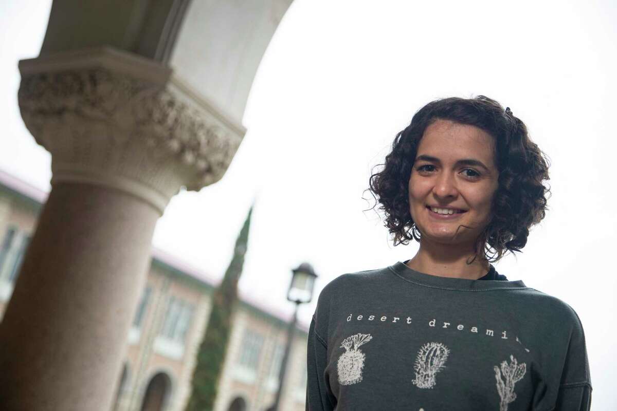 Rice University PhD student Luisa Rezende, 26, poses for a photograph Friday, April 16, 2021, at Lovett Hall in Houston. Rezende, a Brazil native, struggled to get into the US to study during COVID-19 pandemic last year and arrived Houston in February. She said she's happy finally to be in Houston.