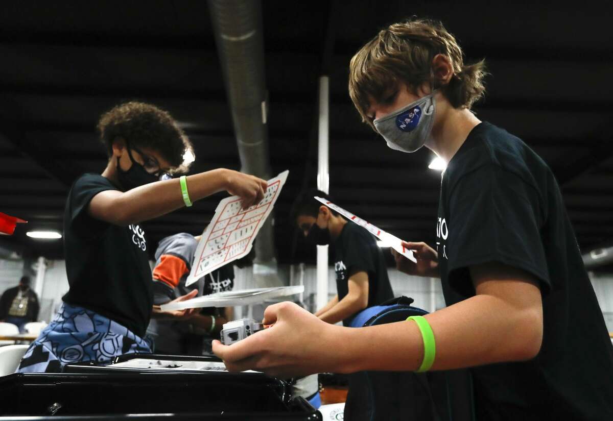 Lanndon Dreahn helps unpack during the ag robotics competition at the Montgomery County Fair & Rodeo, Friday, April 16, 2021, in Conroe. This competition offered students from Montgomery County with an interest in STEM related fields the opportunity to competed against their peers in an agricultural focused course designed to challenge students to use their robot to complete various tasks for points.