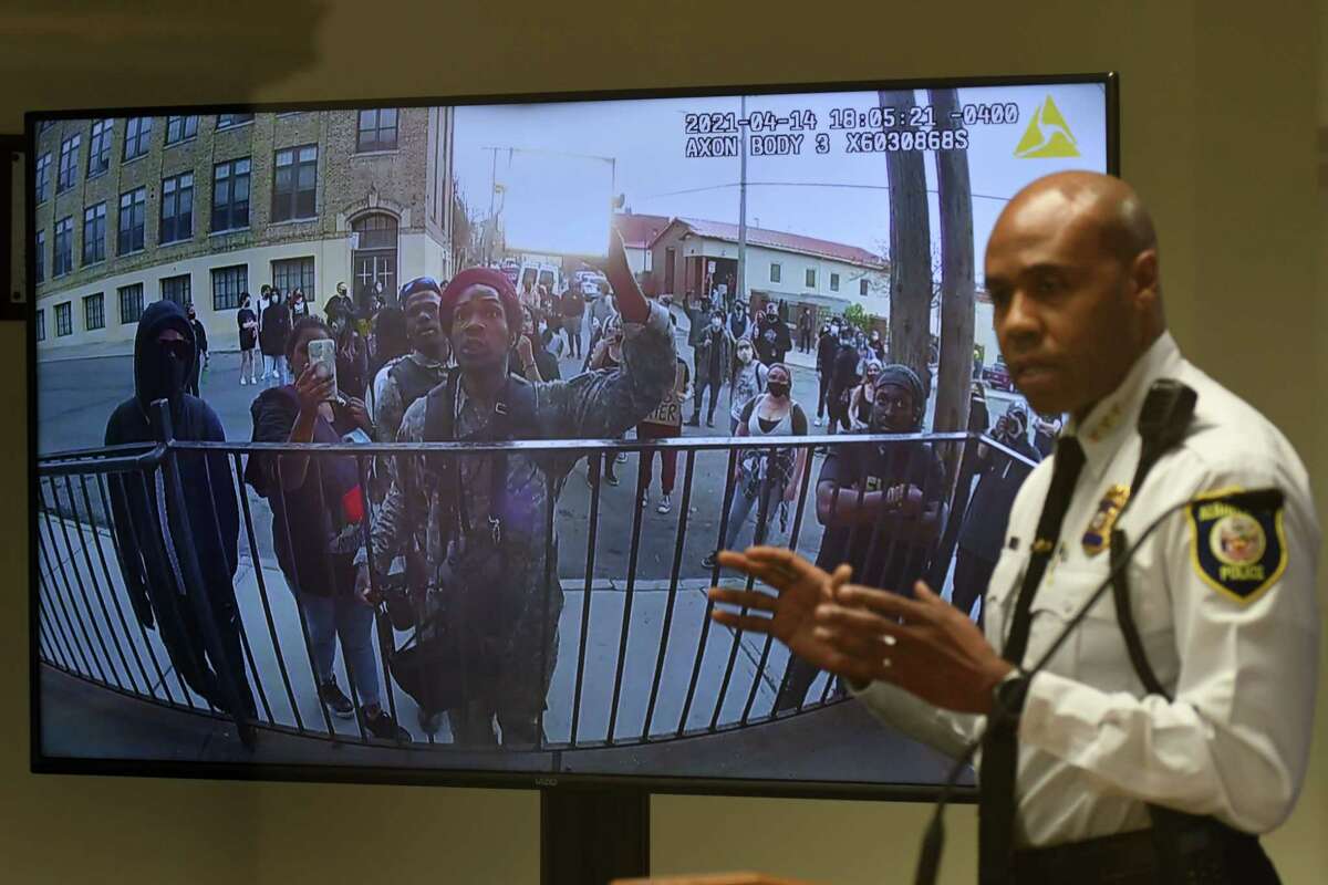Albany Police Chief Eric Hawkins displays police footage of WednesdayÕs altercation between police and protesters at the cityÕs South Station following what began as a peaceful protest against a police killing in Minnesota on Friday, April 16, 2021, during a press conference at police headquarters in Albany, N.Y. A high-intensity light was directed at officers. Sheehan and Hawkins supported the officers' actions and condemned the attack on a city police station. (Will Waldron/Times Union)