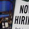 (FILES) In this file photo taken on August 04, 2020, a restaurant displays a "Now Hiring" sign amid the coronavirus pandemic, in Arlington, Virginia. - New applications for US unemployment benefits fell sharply last week, the government said on April 15, 2021, reaching their lowest level since the Covid-19 pandemic caused mass unemployment. The Labor Department said there were 576,000 new jobless claims filed last week, seasonally adjusted, far fewer than analysts had expected and the lowest level since the week ended March 14, 2020. (Photo by Olivier DOULIERY / AFP) (Photo by OLIVIER DOULIERY/AFP via Getty Images)
