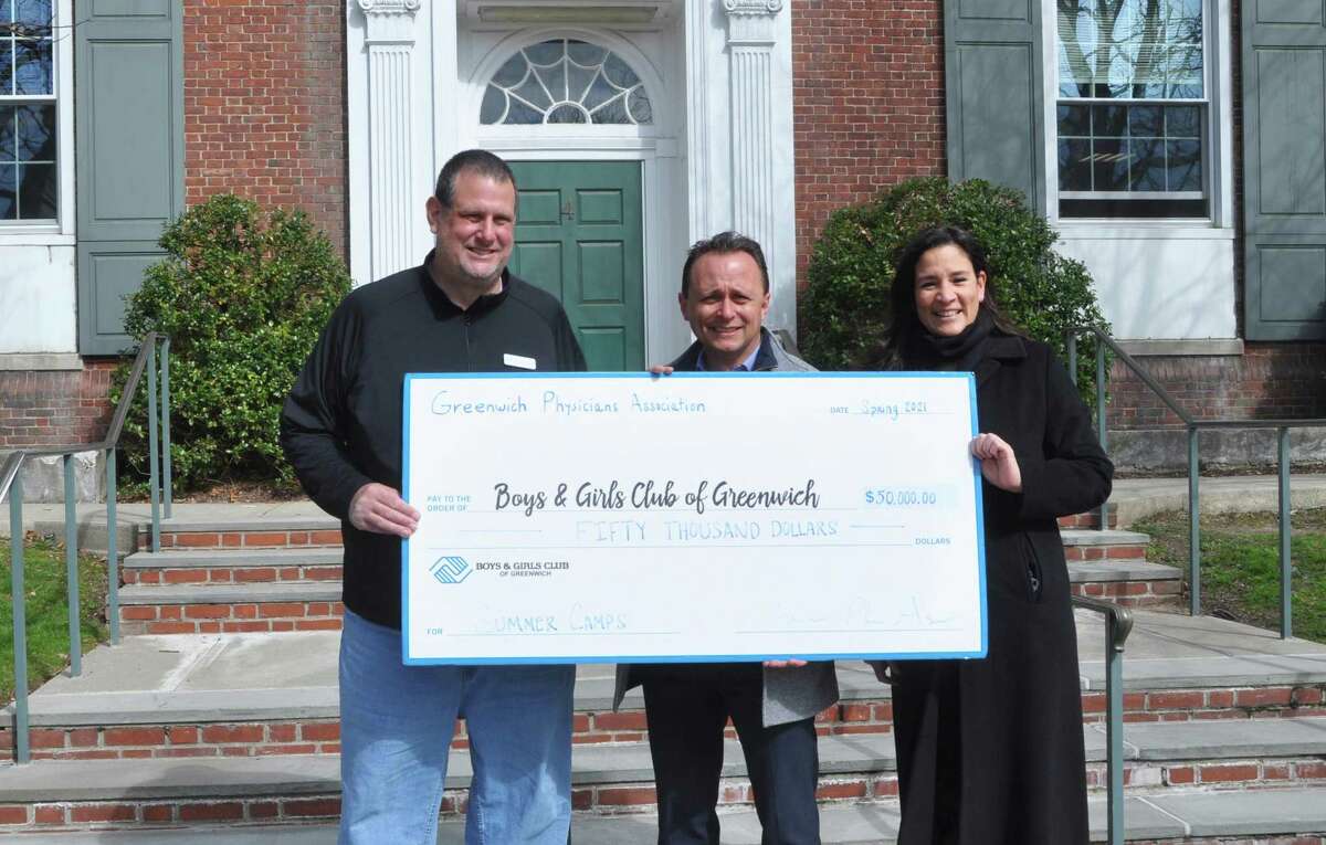 The Boys & Girls Club of Greenwich gets a big boost for its summer camp program recently with a $50,000 donation from the Greenwich Physicians Association Inc. From left, club Vice President of Programs and Youth Development Don Palmer, GPA head Glenn Gandelman and club CEO Cristina Vittoria were there for the big check presentation.